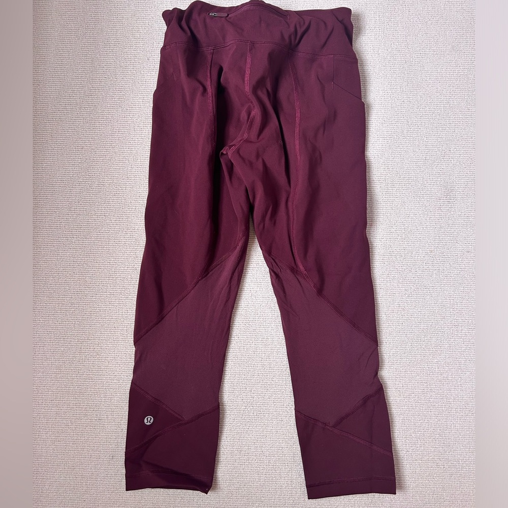 Lululemon Leggings With Adjustable Waistband and Pockets in a Marroon color